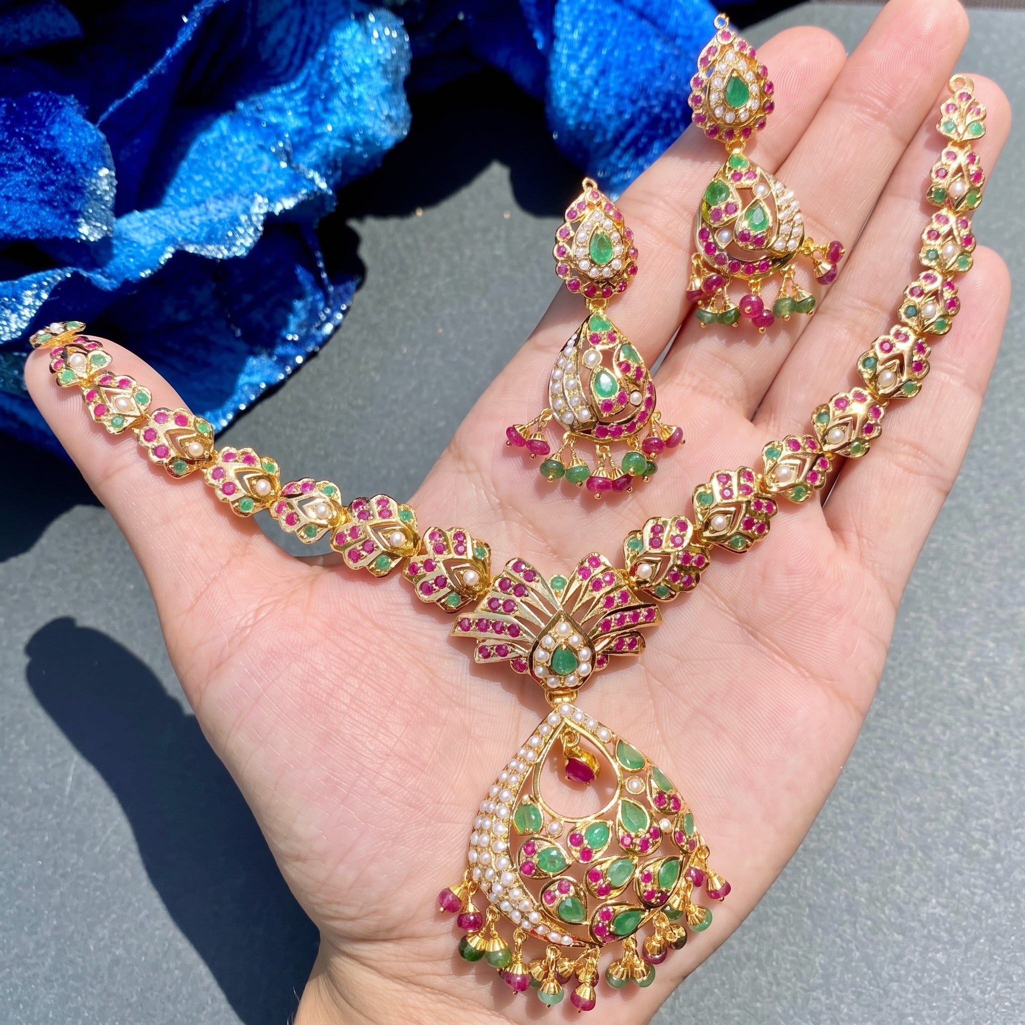 real 22 carat gold set with ruby emerald stones