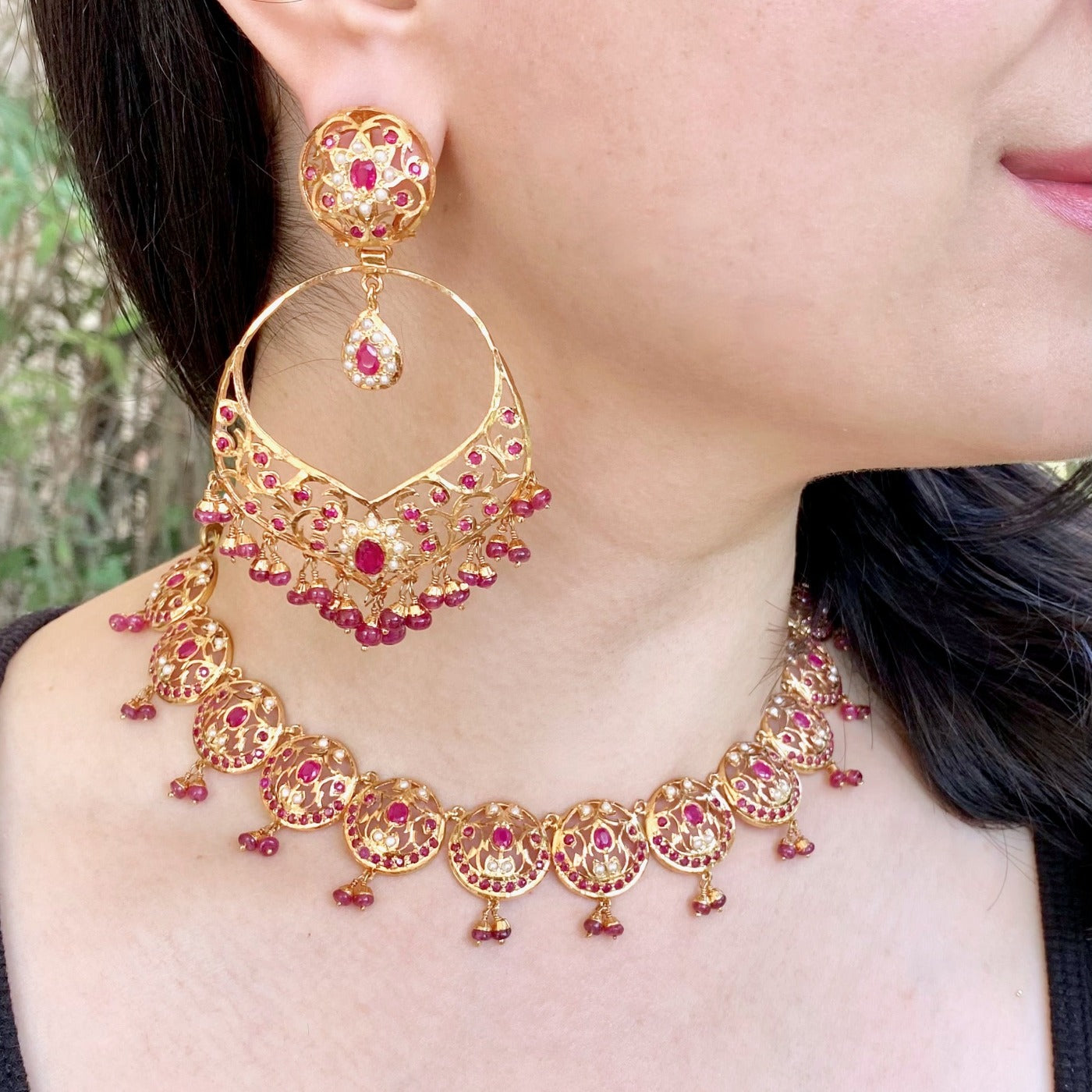 gold plated jadau set with rubies