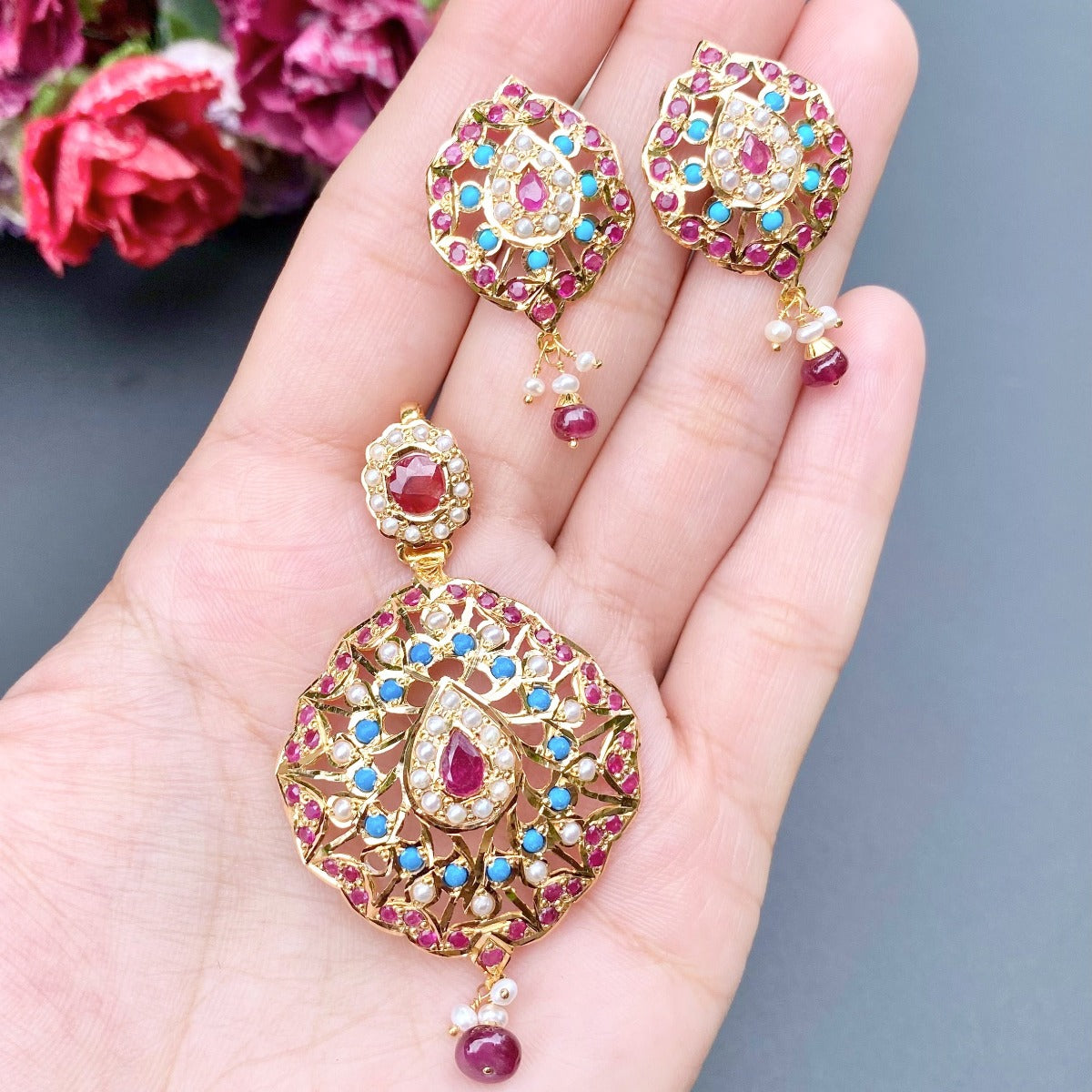 buy Gold pendant set studded with ruby, pheroza and pearls