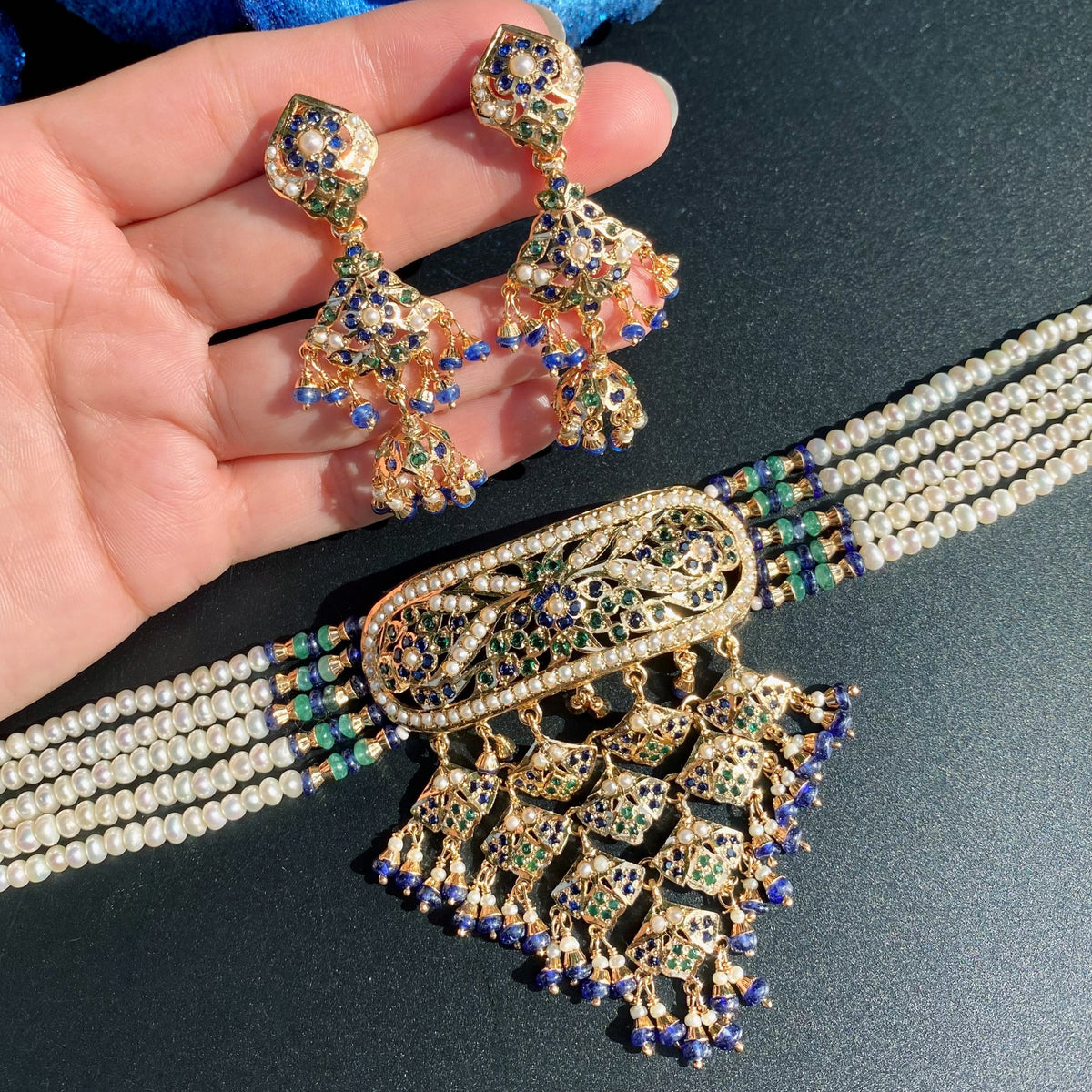 NS 512 necklace and earrings detail showing white pearl borders, blue bead drops and articulated floral lattice work