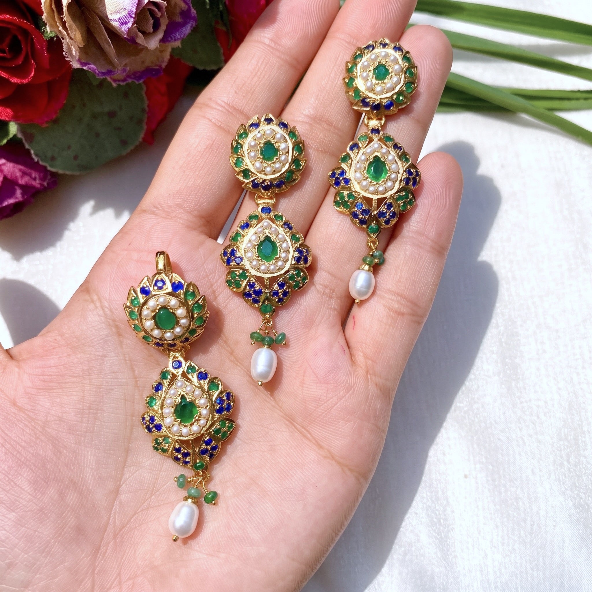 emerald pendant set in gold plated silver