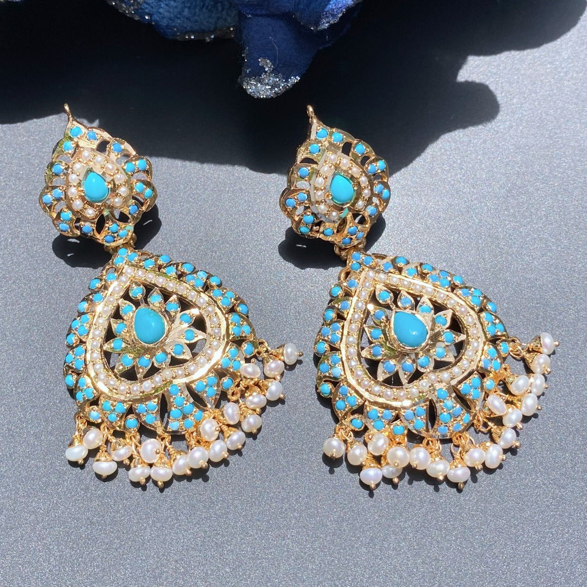 gold plated earrings featuring pearls and turquoise