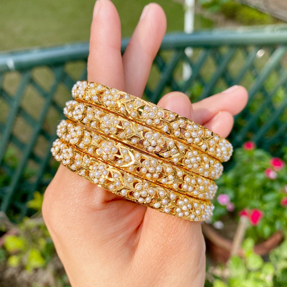 pearl bangles in gold plated silver