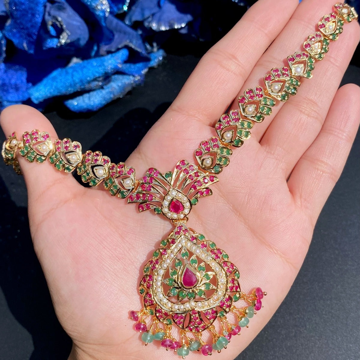 gold placed necklace with gold like finish