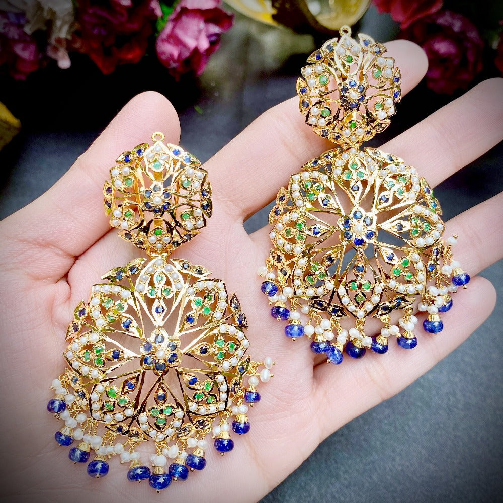 gold earrings studded with precious stones
