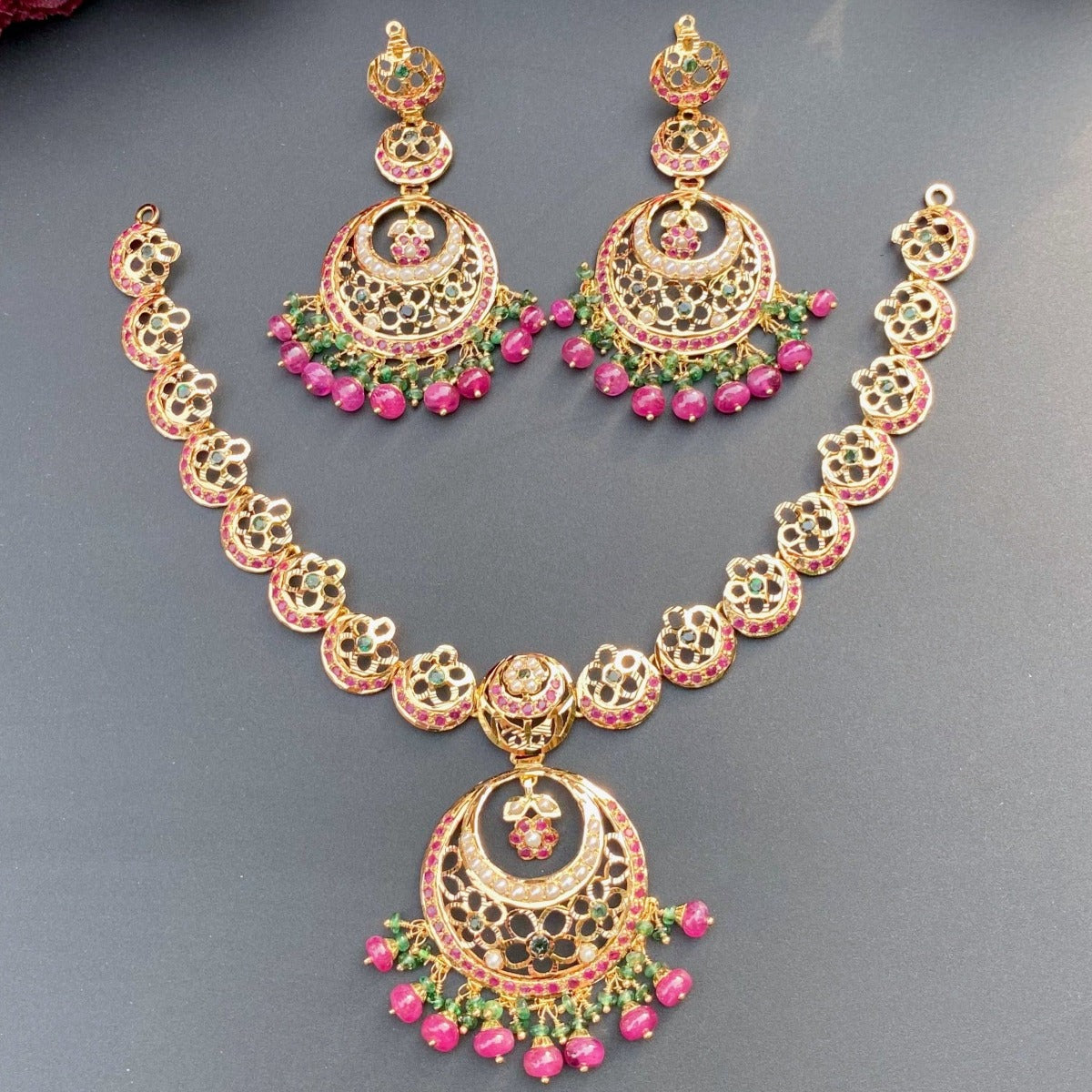 light weight gold necklace set with rubies emeralds
