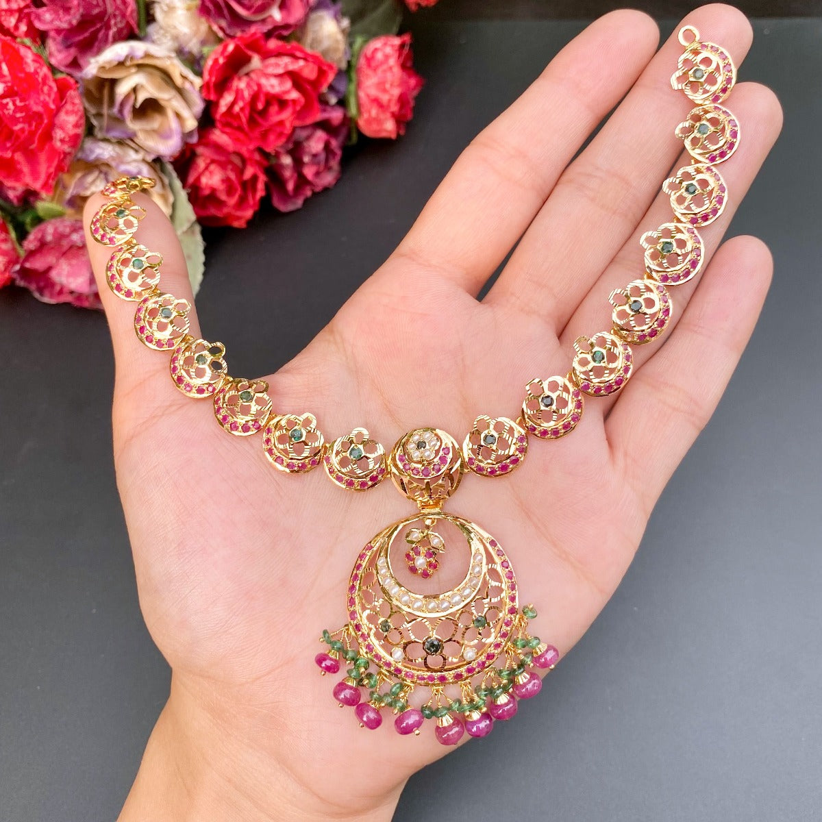 light weight gold necklace set with rubies emeralds