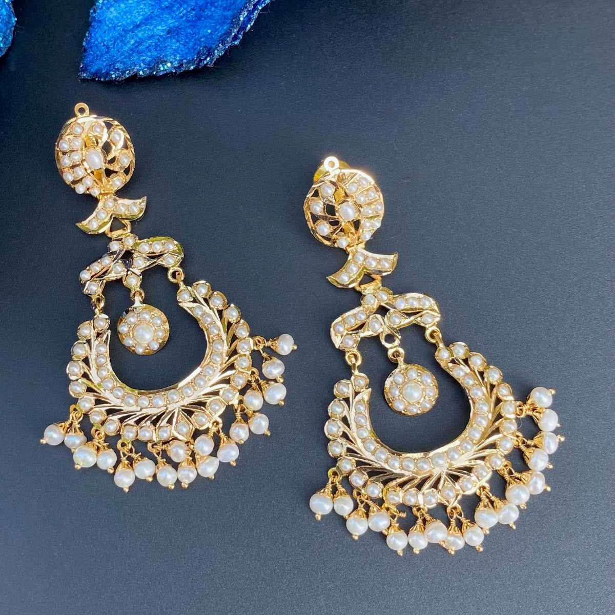 gold chandbali earrings studded with pearls
