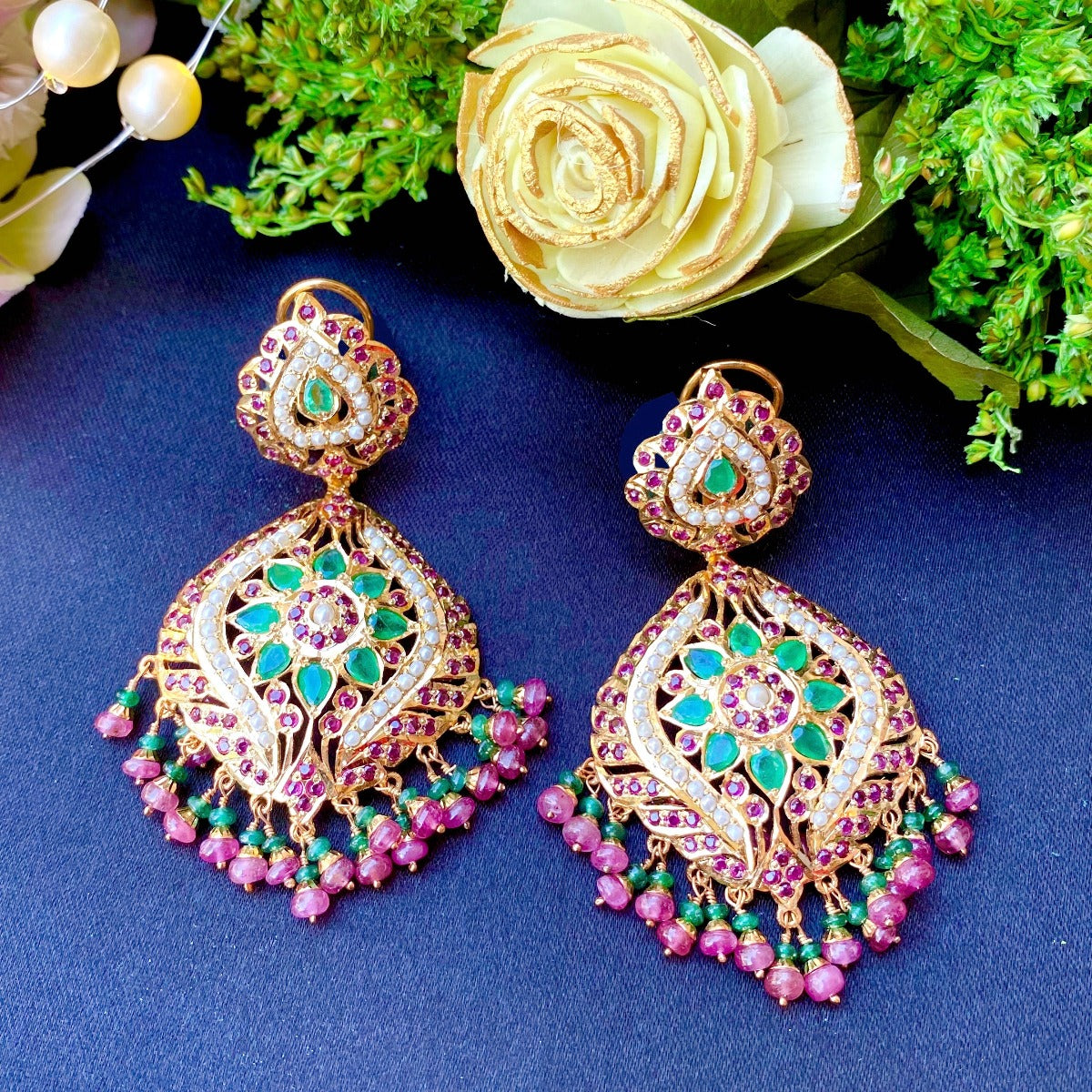 jadau earrings with emeralds