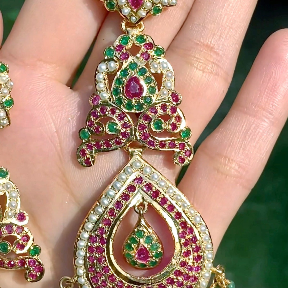jadau long drop shaped danglers in gold plated silver multicolored