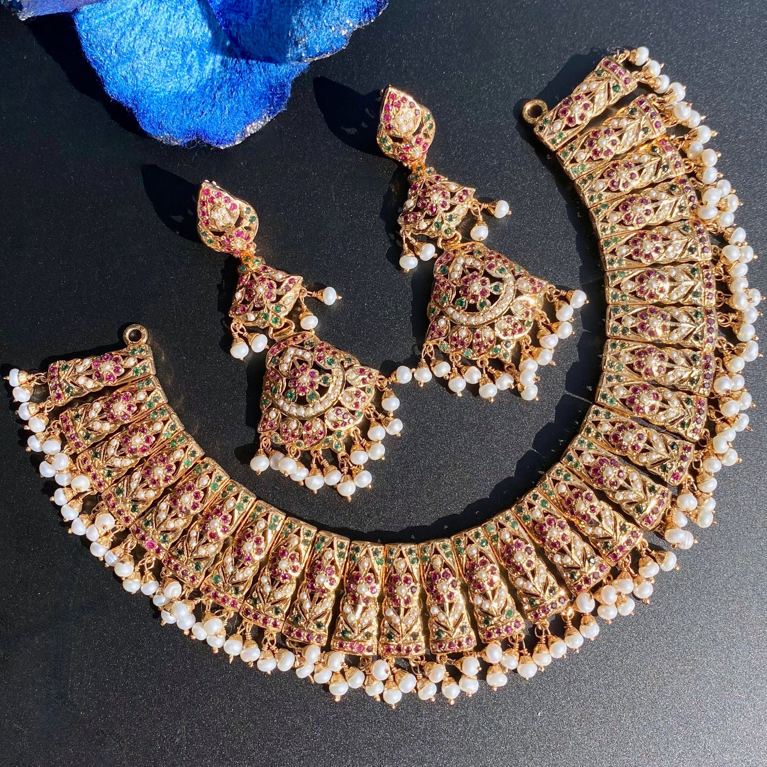 jadau necklace with long earrings