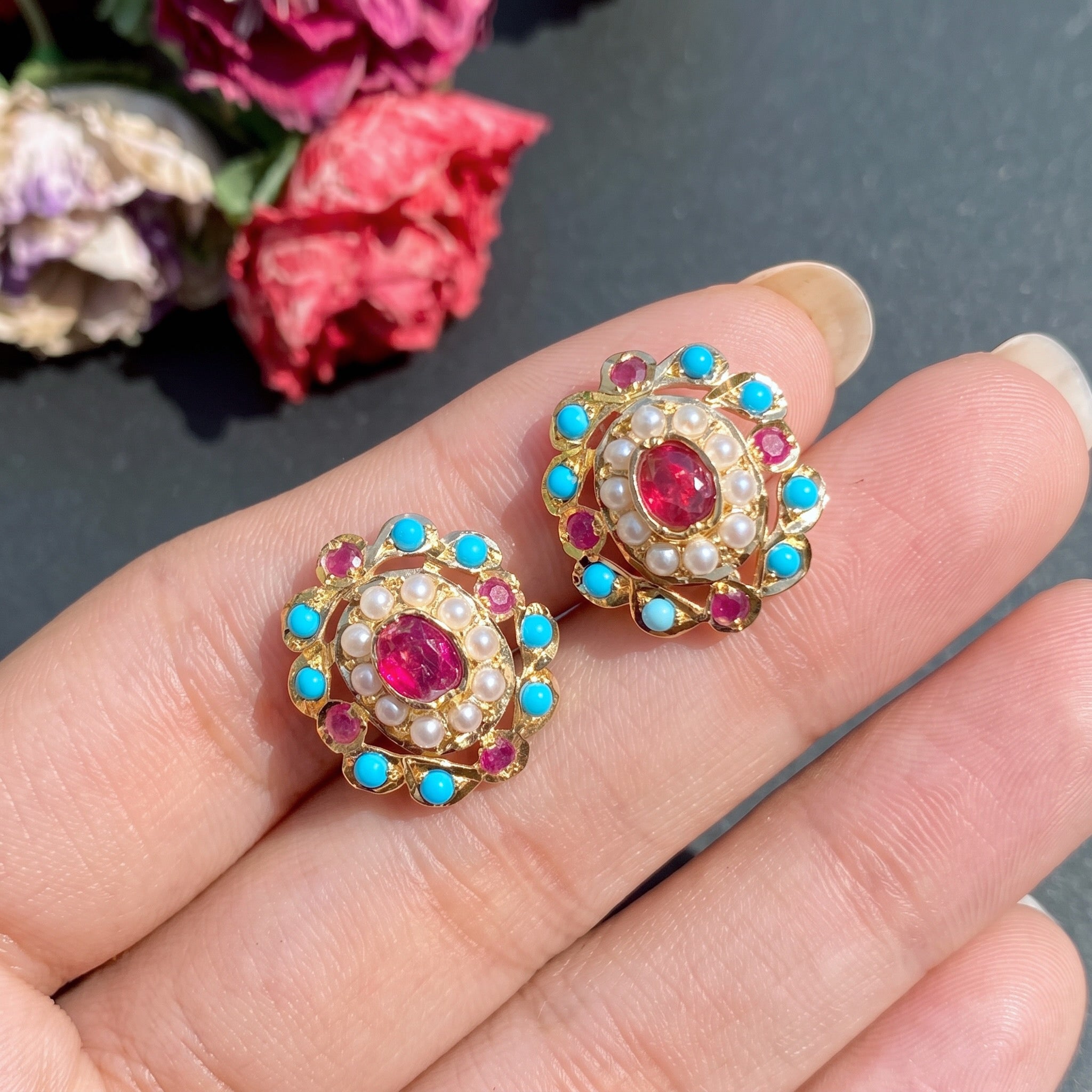 small gold earrings studded with ruby pearl and phiroza