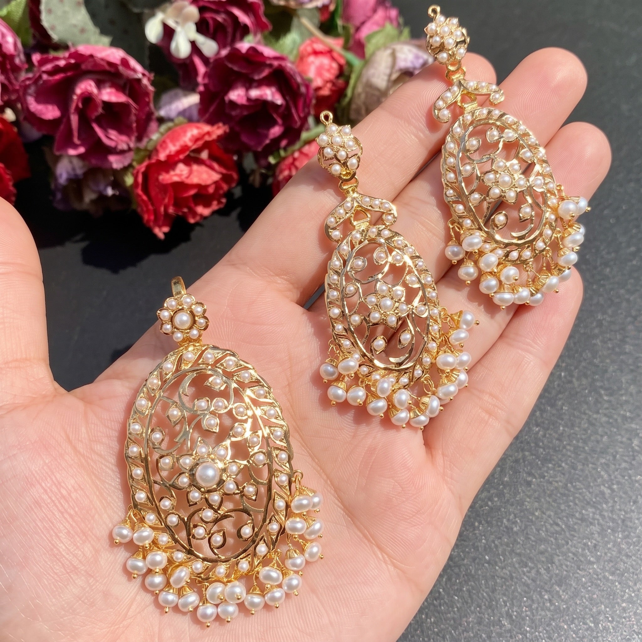 gold pendant set studded with freshwater pearls