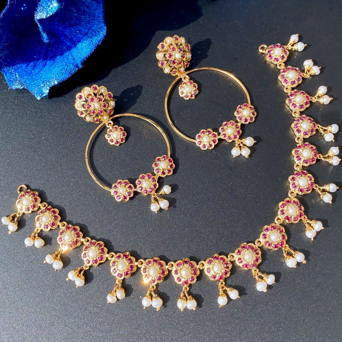 delicate jadau set in ruby and pearls