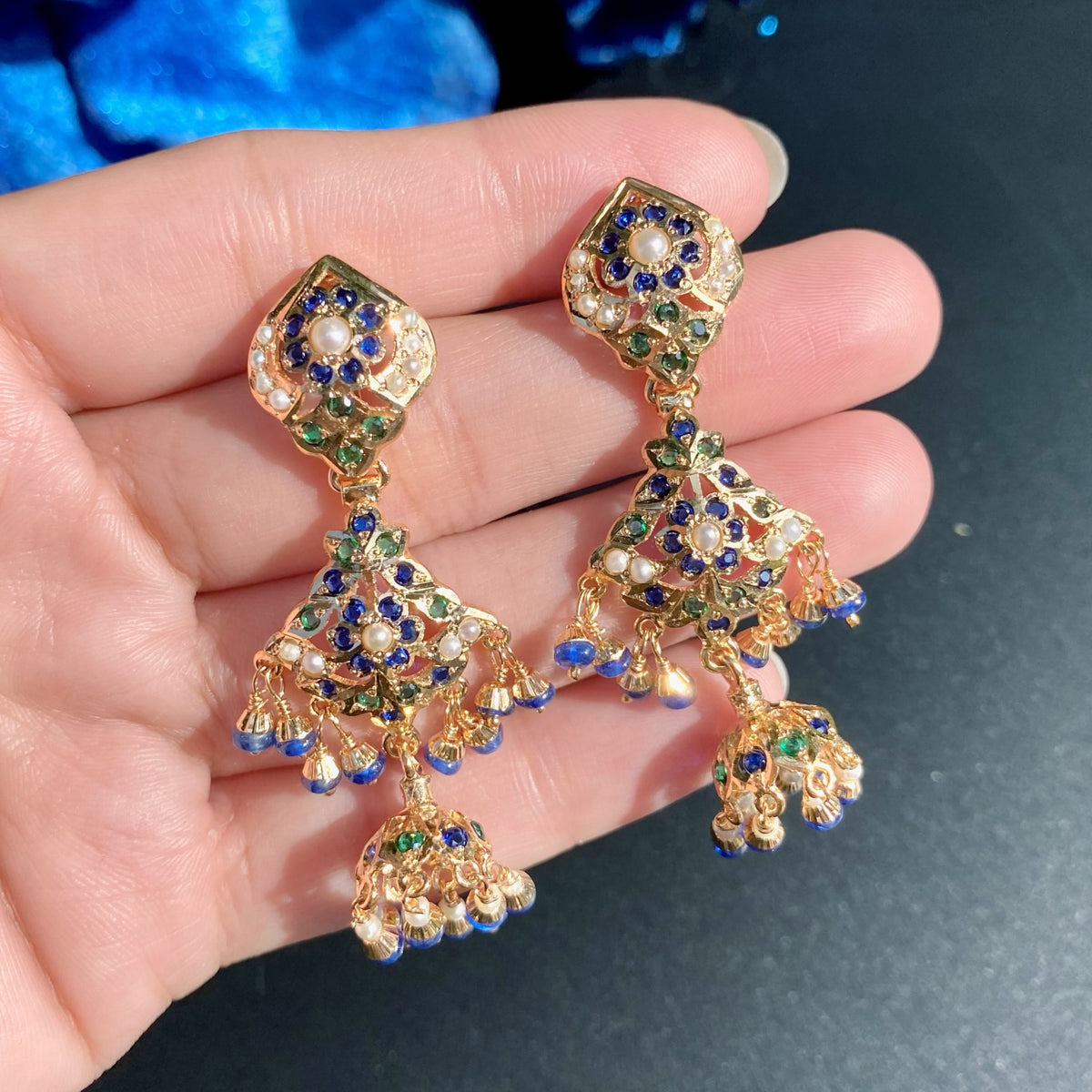 NS 512 matching earrings with leaf-shaped floral studs, blue and green detailing, beaded fringes and suspended jhumka domes