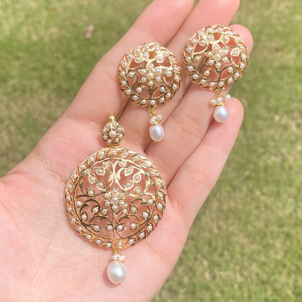 gold pendant set studded with freshwater pearls