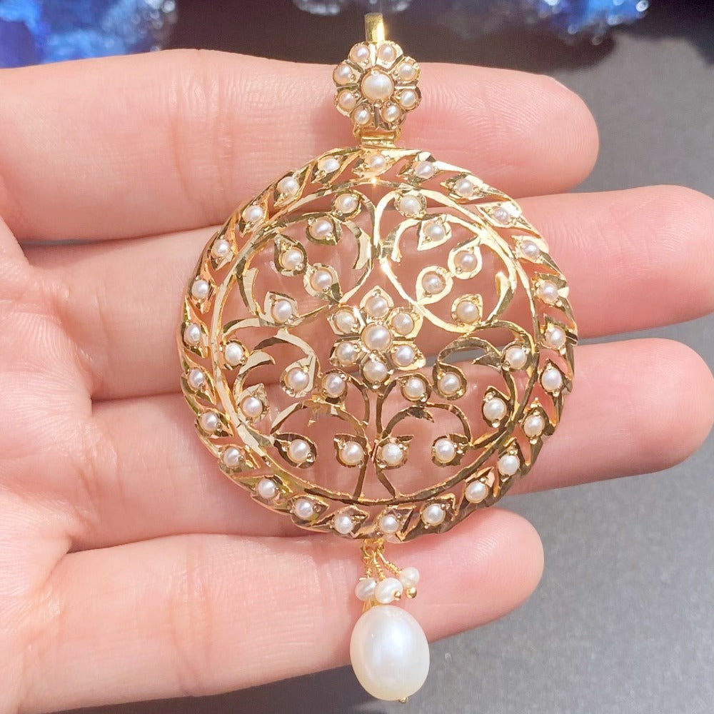 antique gold pendant studded with pearls