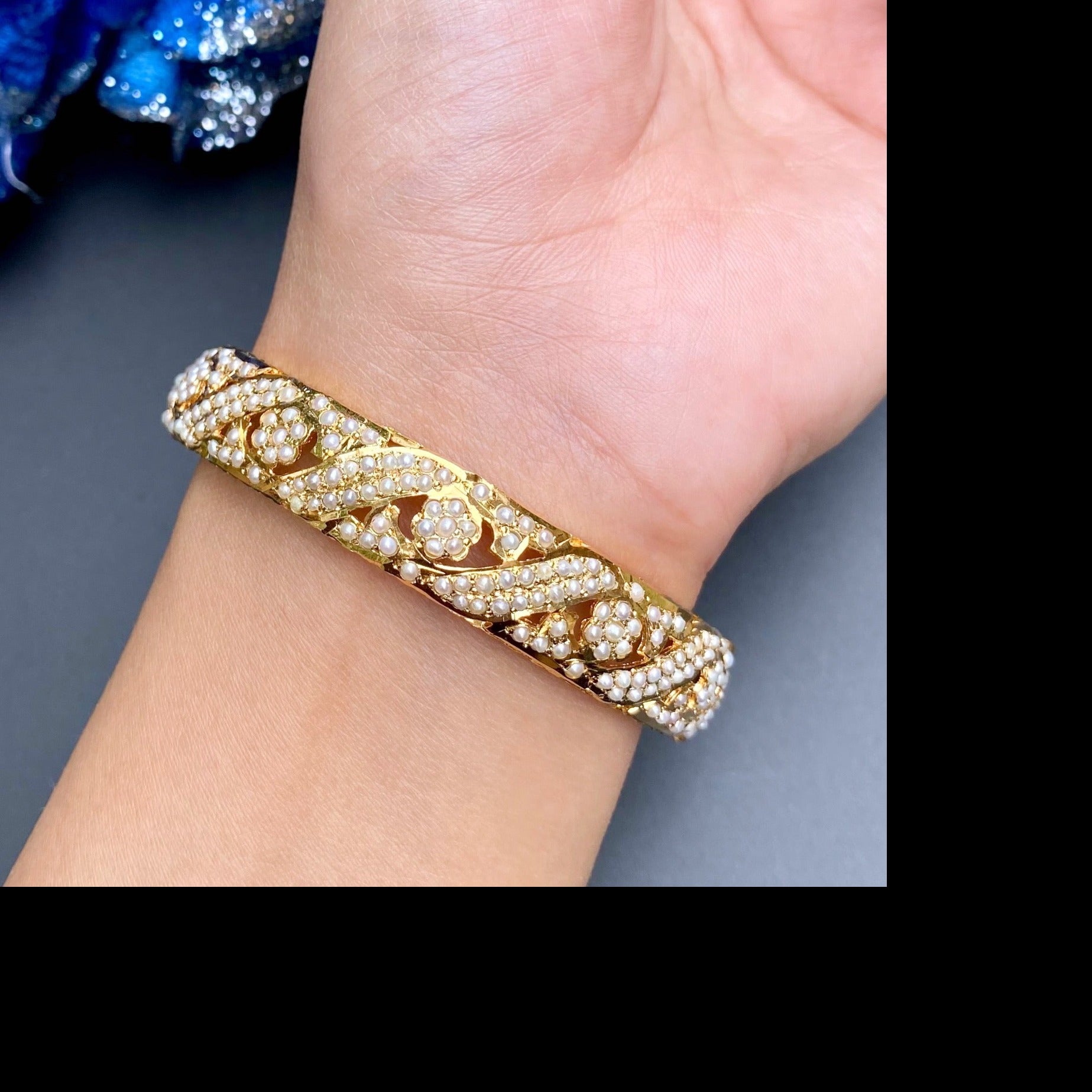 intricate pearl bangle on gold plated silver