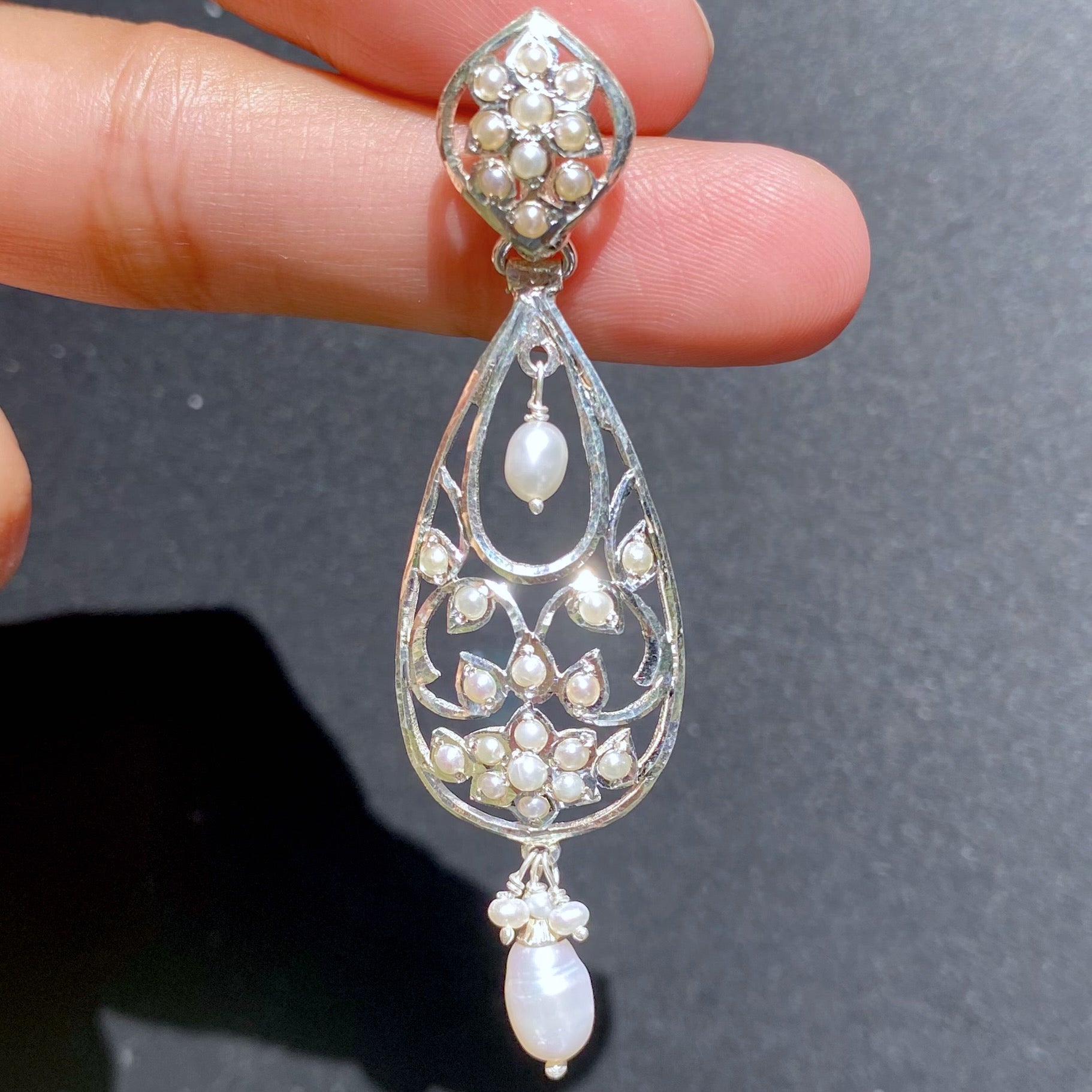drop shaped pearl earrings on silver