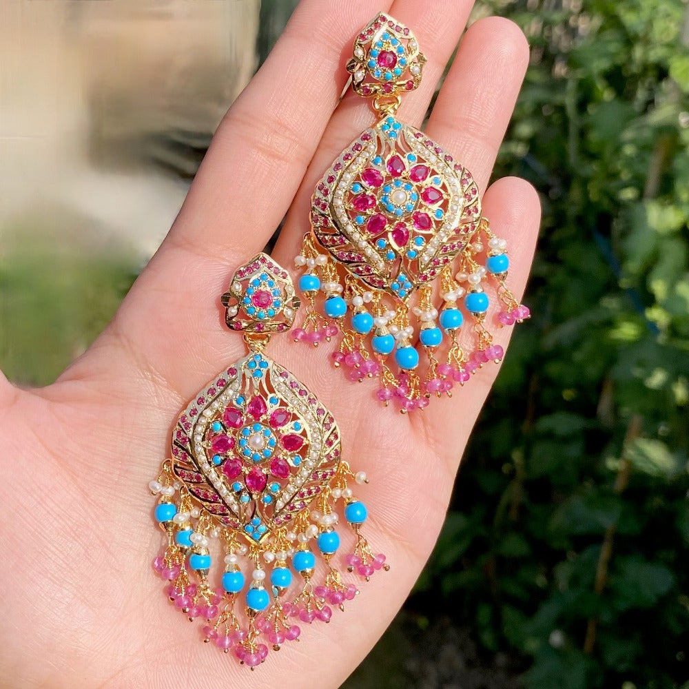 jadau earrings on silver