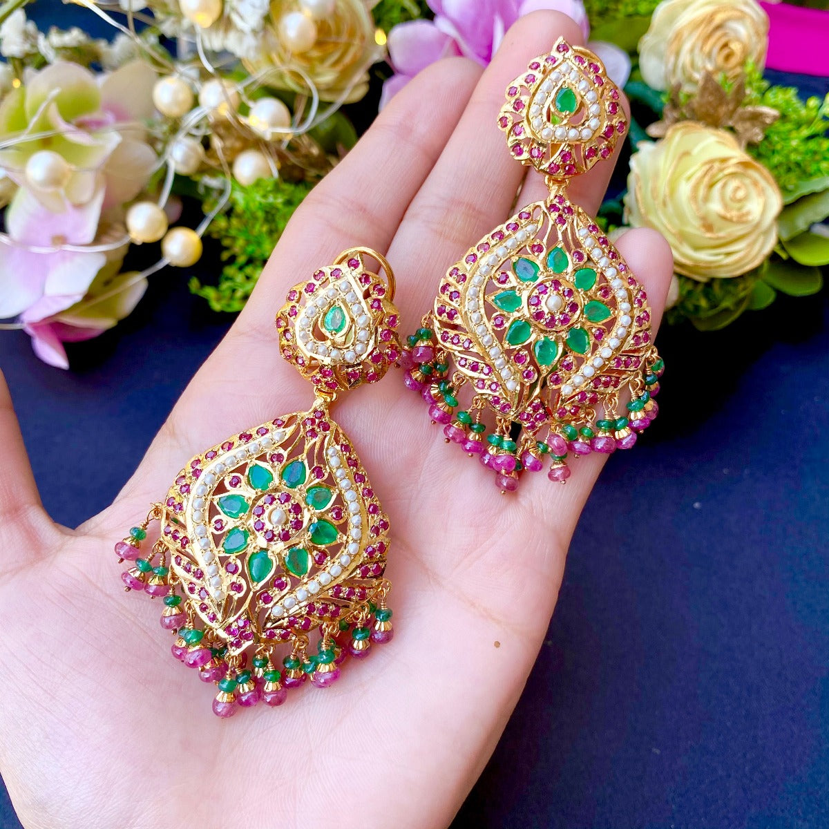 jadau earrings with emeralds