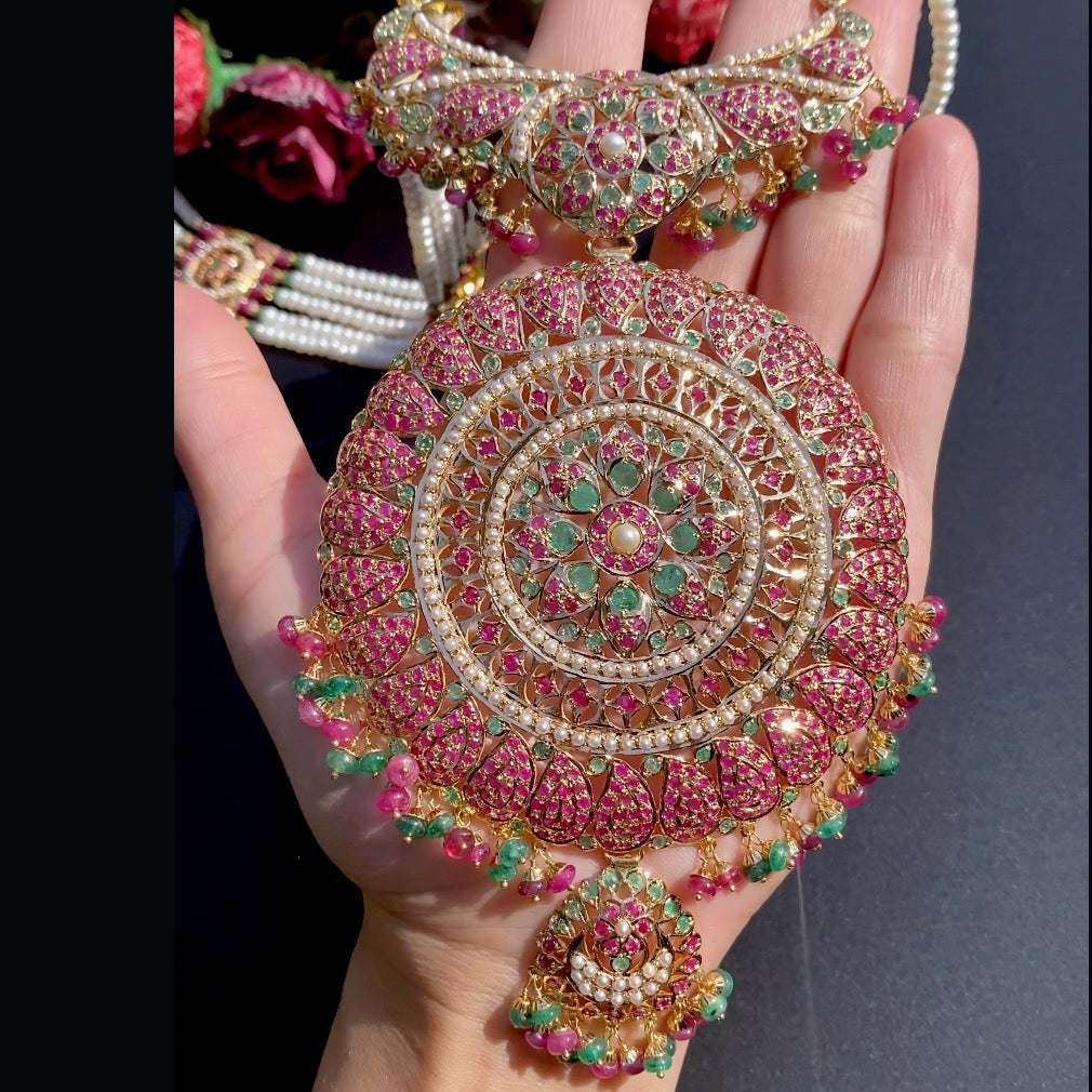 Regal Intricate 22k Gold Rani Haar for bride studded with rubies emeralds and pearls