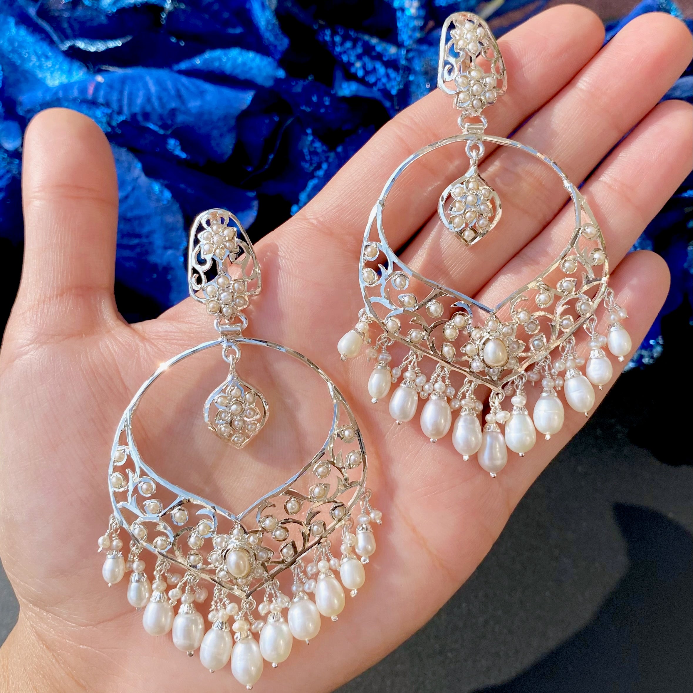 earrings for girls made on silver and studded with pearls and finished with pearl drops