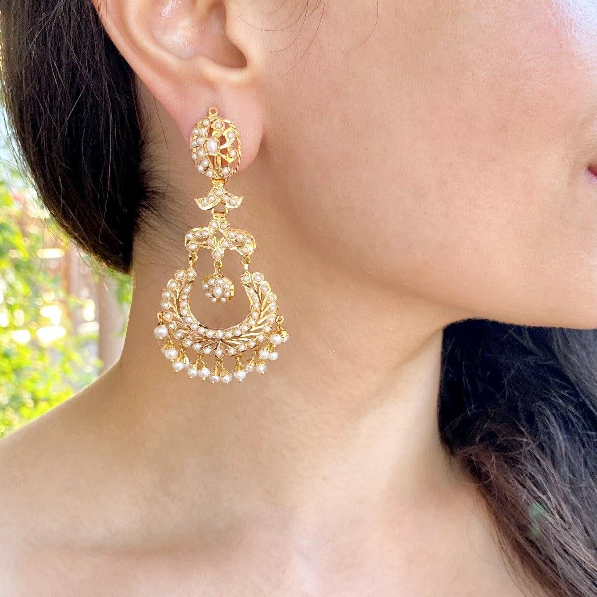 gold chandbali earrings studded with pearls