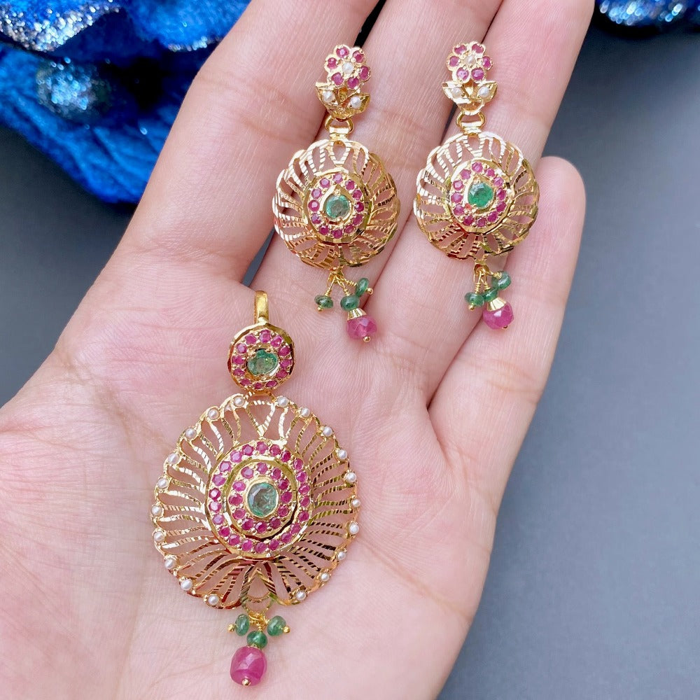 exquisite 22k gold pendant set studded with emeralds and rubies