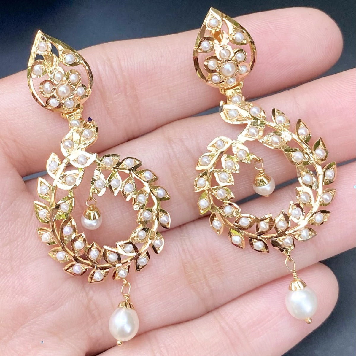minimalistic gold earrings studded with pearls