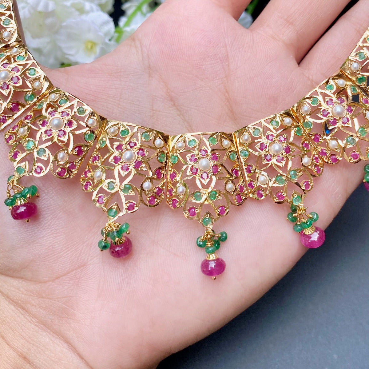 classy gold necklace with rubies emeralds and pearls