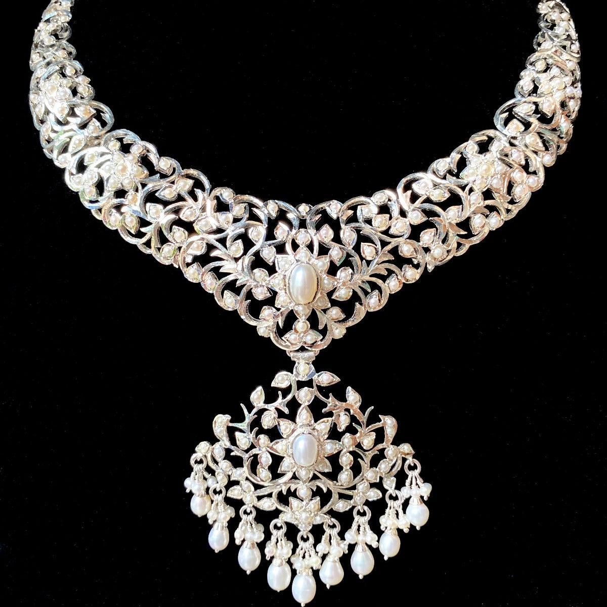 silver necklace studded with pearls