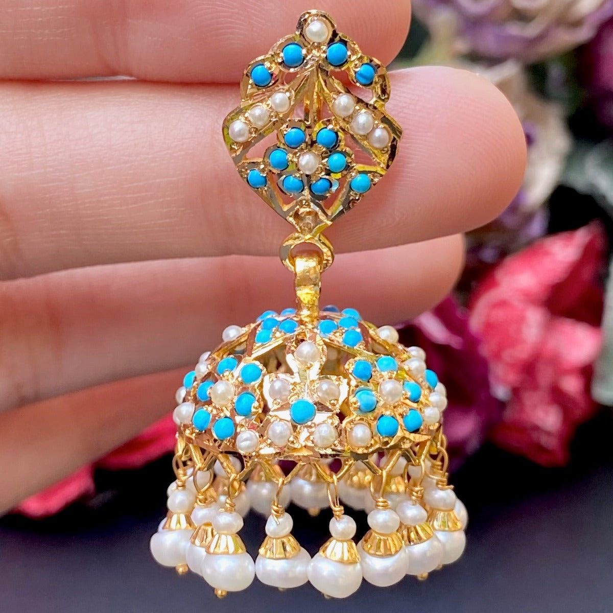 gold jhumka studded with pearls and feroza