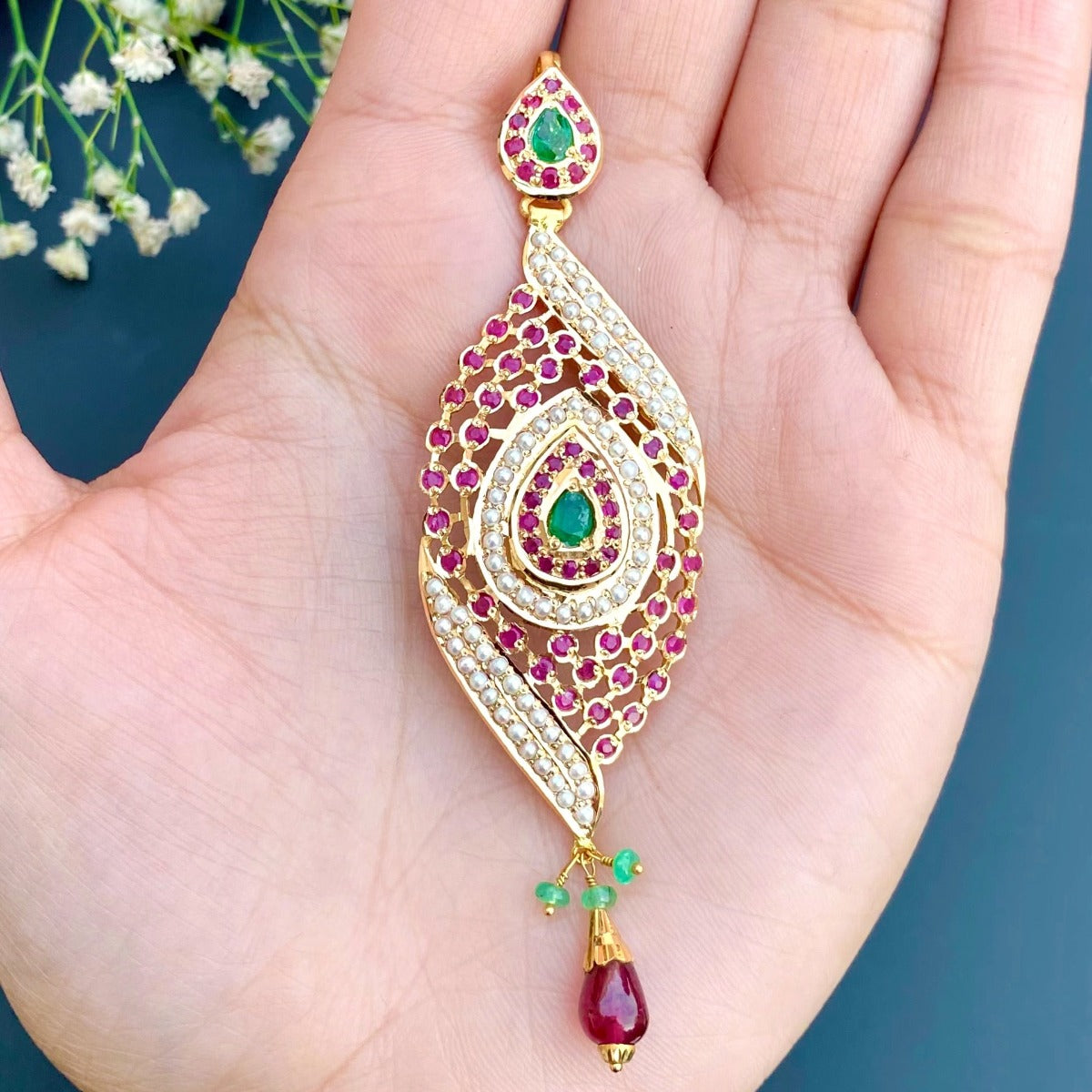gold pendant with ruby drop