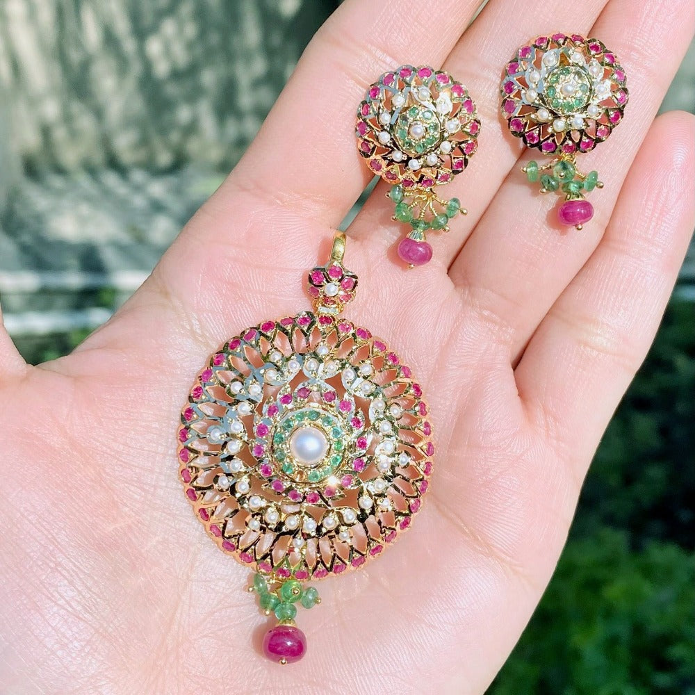 gold pendant set studded with colorstones