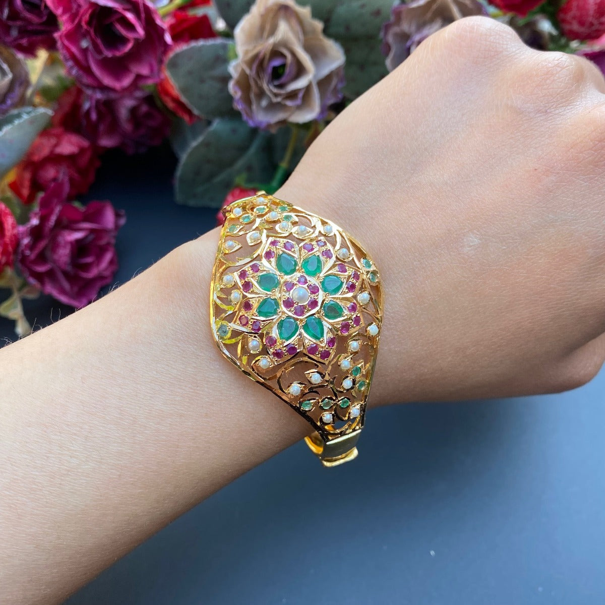 Tanishq - A luminous cuff bangle with a breathtaking amethyst in the centre  that is serenaded by pink rubies, 'Joy of Fairytales' is bedecked with  floral bursts of baguette diamonds that cascade