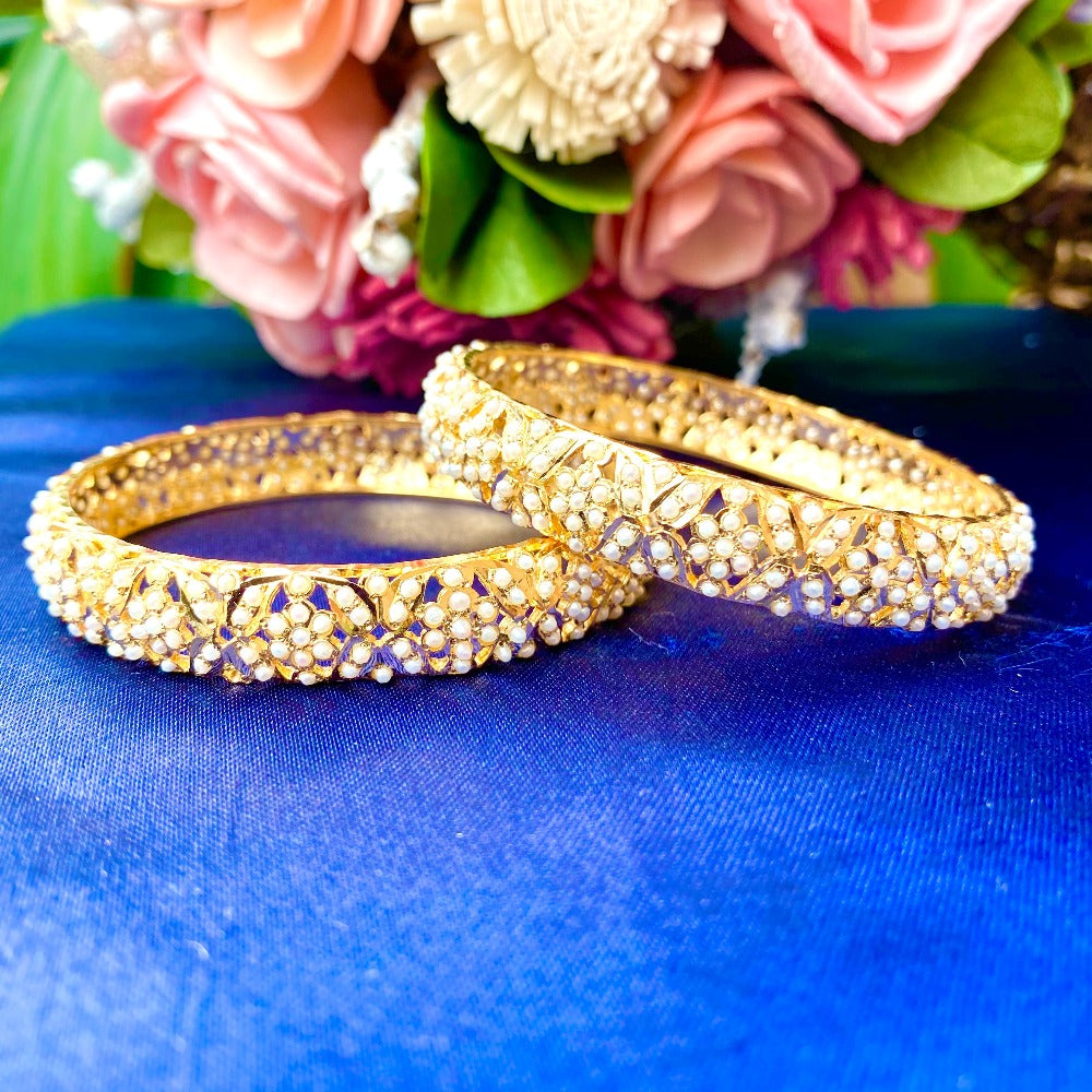 pearl bangles in gold plated silver