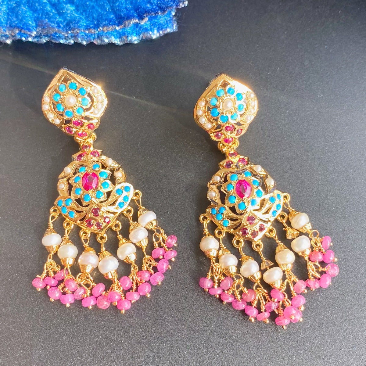 gold polished earrings with ruby bunches